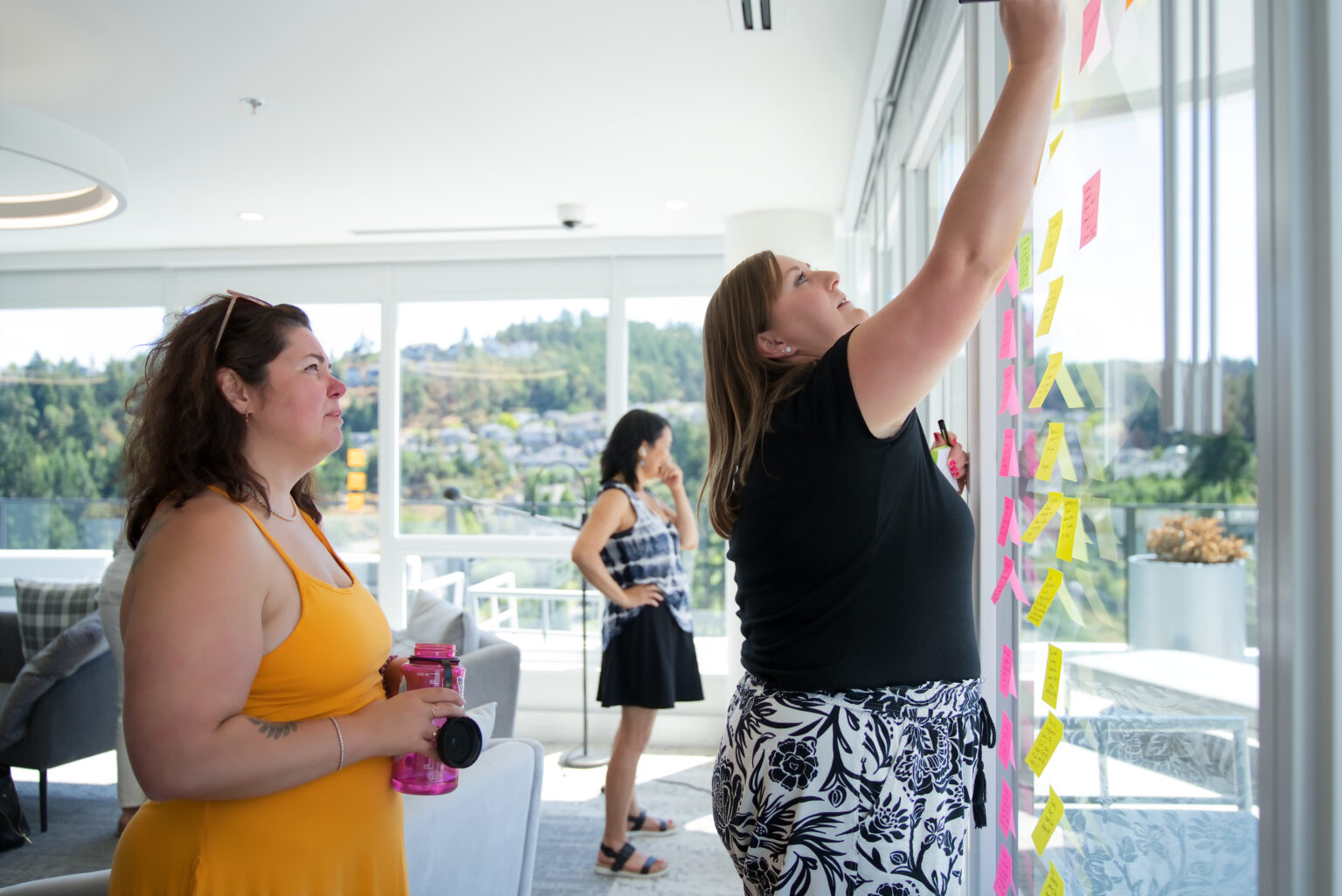 A writer adding a chapter to the story wall