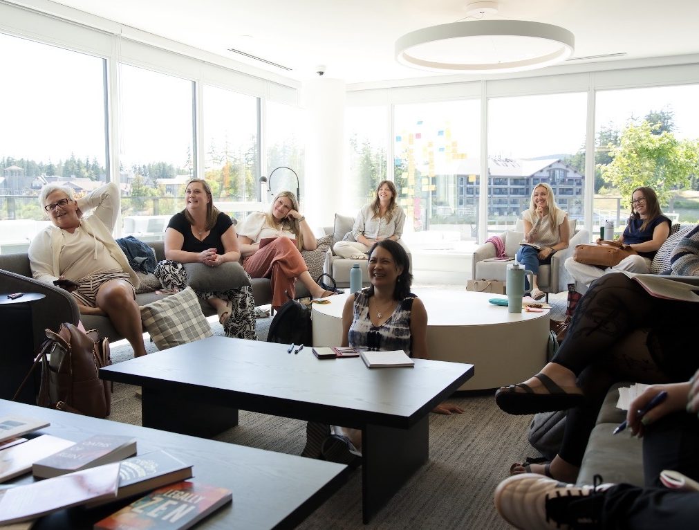 Writers laughing together in the retreat lounge