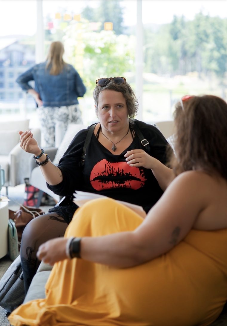 A writer talking through her book with the room