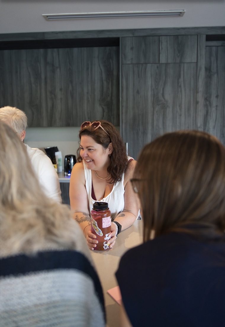 Crystal mid-conversation with writers over coffee