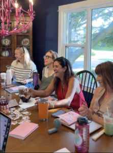 A table of writers working together at a Createcation writing retreat